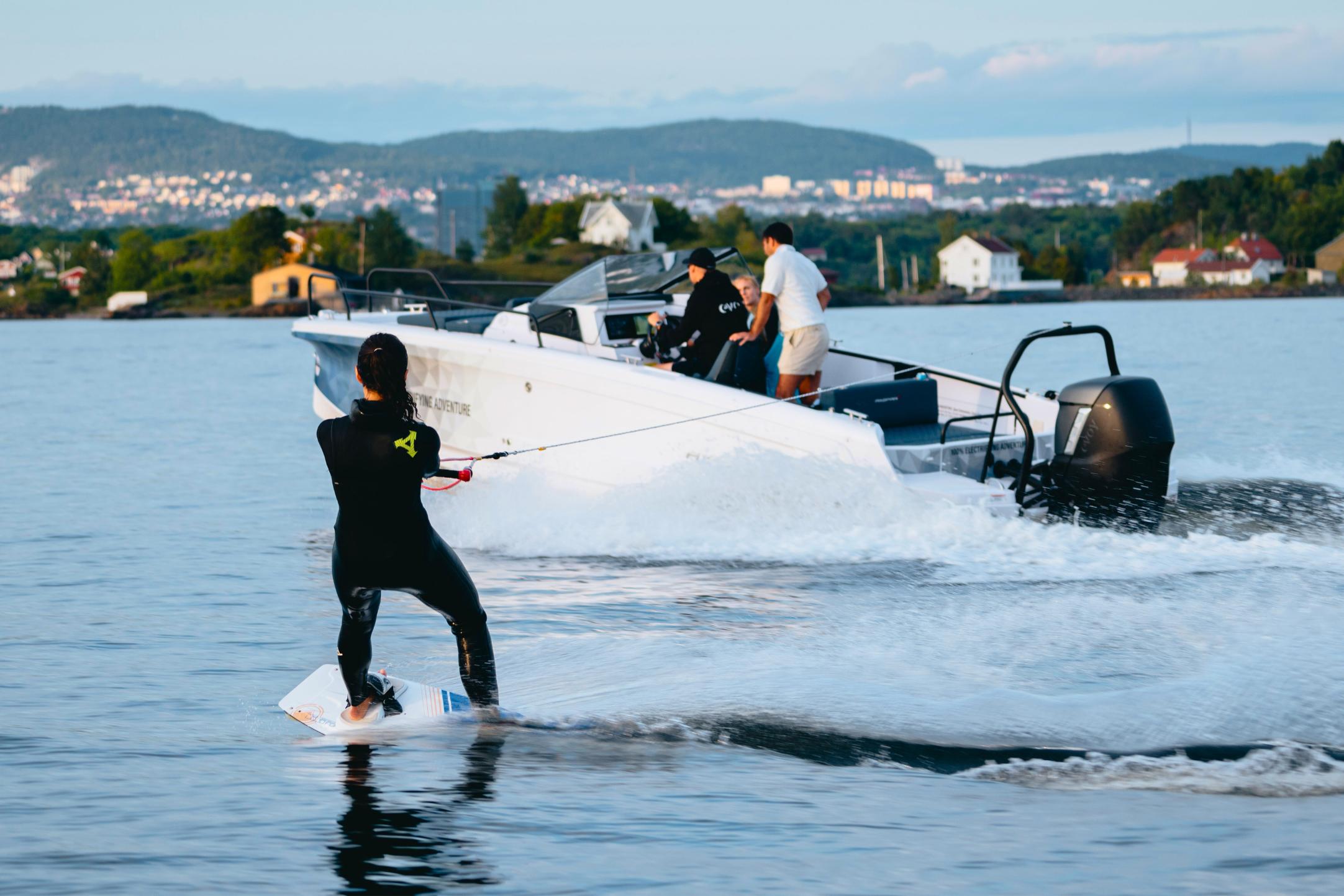 Axopar 25 Powered by Evoy Storm 300hp electric outboard motor - girl wakeboarding