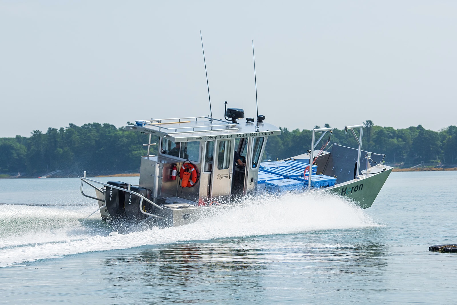 Electric Innovation Hits the Working Waterfront in Maine 1 Maine Ocean Farm's electric boat in speed powered by Evoy electric outboard motor
